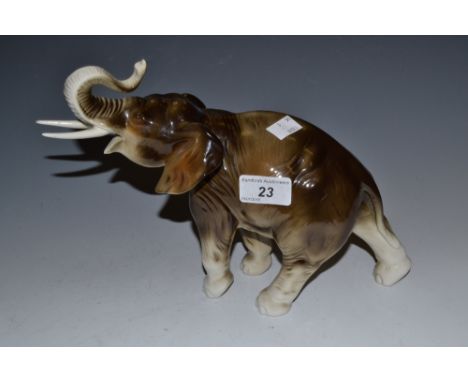 A Royal Dux elephant, trunk raised, pink triangle mark, model no.378