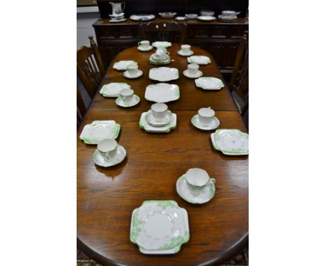 A Royal Grafton tea set , pattern 2617 painted with stylised green and yellow flowers,  including, two bread plates, milk jug