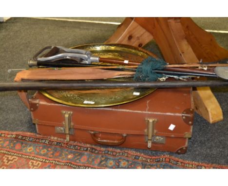 An Arts and Crafts brass charger; a shooting stick; a vintage suitcase; etc