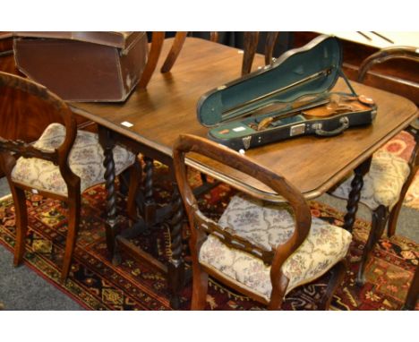 A George V oak barley twist gate leg drop leaf dining table, c.1930