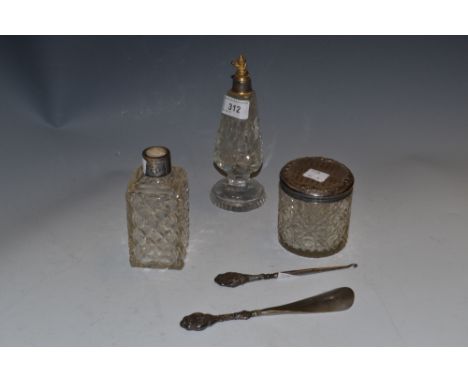 A silver topped dressing table jar, hobnail cut; a silver hafted shoe horn and button hook; etc 