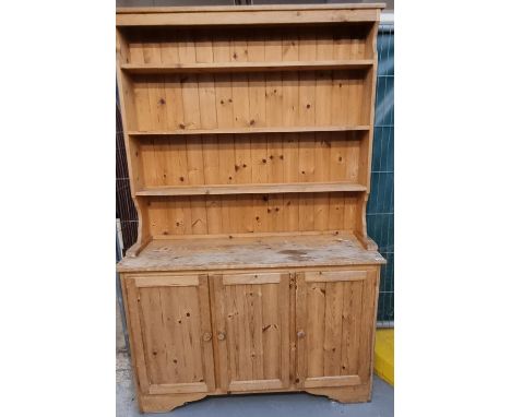 Modern stripped pine kitchen dresser with boarded three shelf rack back and three cupboards to the base.   (B.P. 21% + VAT) 