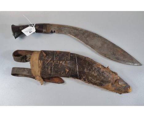 Nepalese Kukri in leather scabbard with laced frog having two belt loops.  (B.P. 21% + VAT) 