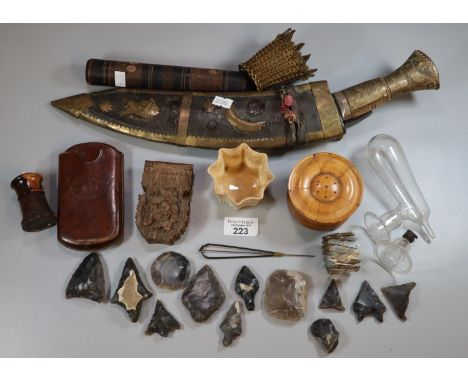 Box of oddments to include: Kukri in leather case, leather cigar case, flint arrow heads, needlework box, treen boxes etc.   