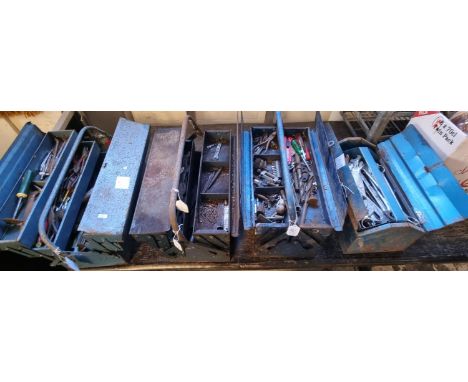 Four metal cantilever and other tool boxes containing a wide selection of assorted spanners and other mechanic's type tools, 
