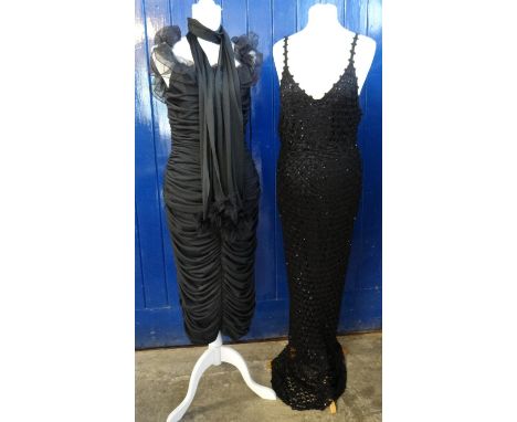 A Treena Lewis and Marjon Couture at Baker Sportswear black ruched cocktail dress with matching scarf with ostrich feather en