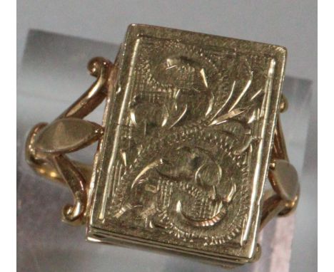 Gold mourning ring with hinged cover and chased decoration.  Birmingham hallmarks.  6.7g approx.  Size Q.   (B.P. 21% + VAT) 
