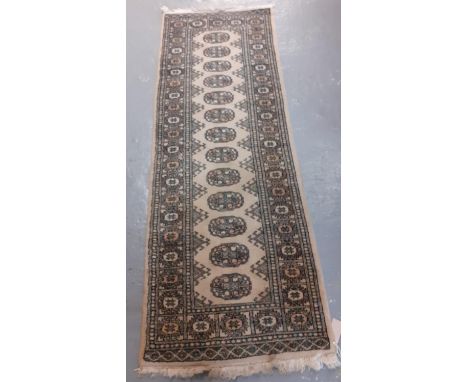 Three modern Bokhara style cream ground runner.  248x84cm approx and 181x64cm approx.  (3)   (B.P. 21% + VAT) 
