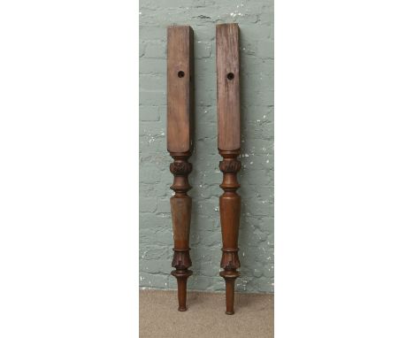 A pair of Victorian carved mahogany bed posts or newel posts.