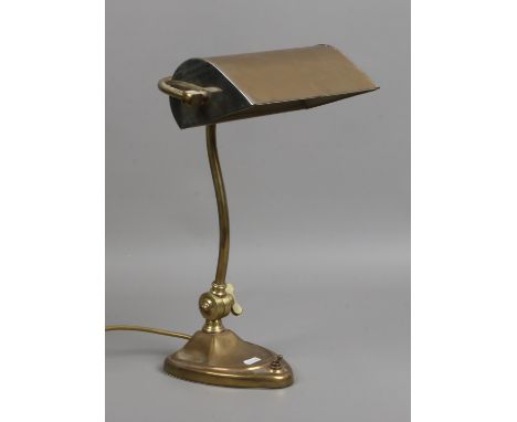 A brass desk lamp.