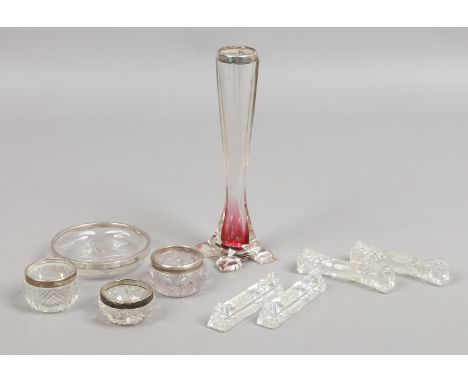 A group of silver mounted glass items including salts, vase etc, along with two pairs of cut glass knife rest.