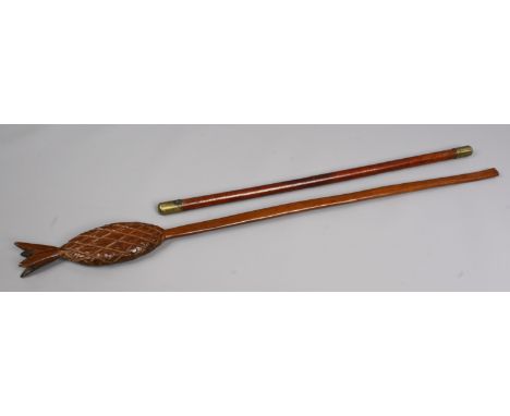 A walking stick or club with carved pineapple terminal along with a swagger stick.