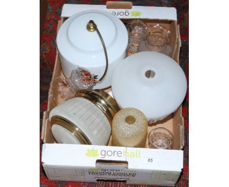 A box of vintage glass light shades.