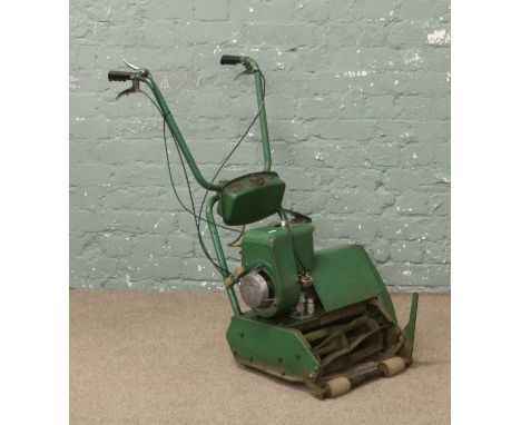 A Atco cylinder lawn mower and grass box with four stroke petrol engine working condition.