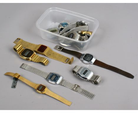 A group of assorted vintage digital watches and watch heads including Timex.