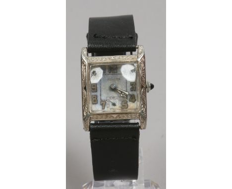 A gentlemans Art Deco hallmark manual Tank watch with square dial and subsidiary seconds.