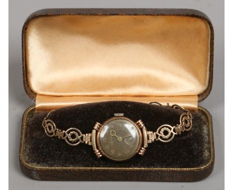 A vintage ladies manual 9ct gold Accurist dress watch with subsidiary seconds on 9ct gold bracelet.