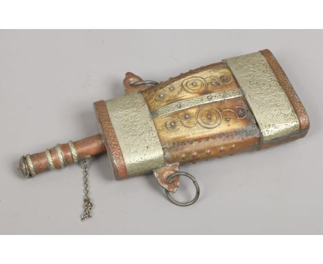 An Islamic horn powder flask with copper and white metal mounts.