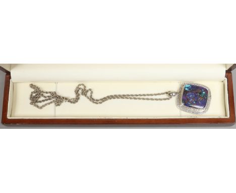 A silver pendant set with hardstone on silver chain.