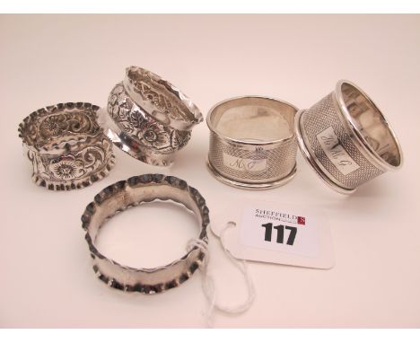 A Pair of Hallmarked Silver Napkin Rings, engine turned decoration, initialled; together with three further napkin rings. (5)