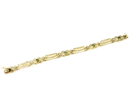 A 19th century 15ct fancy link gold gate bracelet with four bezel set peridot stones, length approx 18cm, approx 13g.