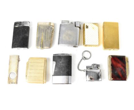 A collection of various cigarette lighters to include a Calibri Molectric with gold plated engine turned body, a small Atlas 