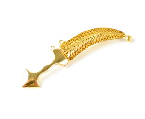 A bright yellow metal brooch in the form of a Middle Eastern dagger, the filigree scabbard with removable dagger, unmarked, l