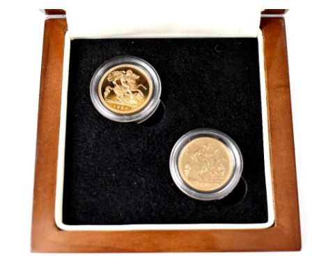 Queen Elizabeth II 'First Half Sovereign Pair' two gold half sovereign coins, 1980 and 1982, both encapsulated displayed in a