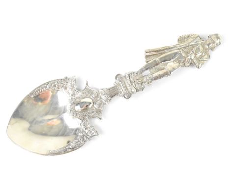 A Victorian hallmarked silver decorative serving spoon, shield-shaped bowl with vacant cartouche, with raised floral decorati