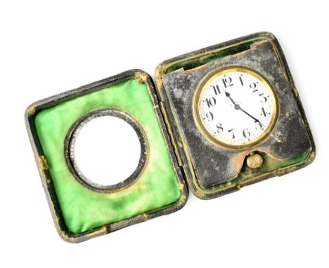 An eight-day travelling clock, the enamelled dial set with Arabic numerals, within a leather case with green satin and planis