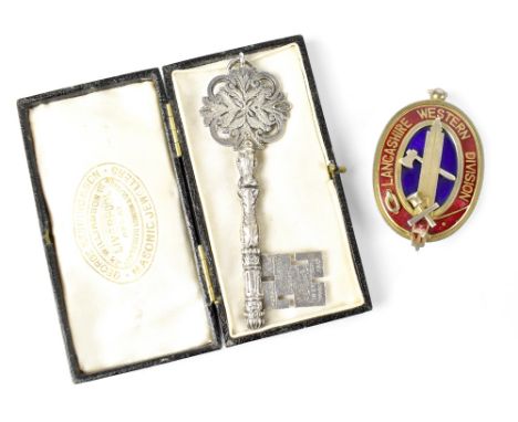 A Masonic silver pendant of oval form, enamelled with red and blue guilloché decoration for 'Lancashire Western Division' wit