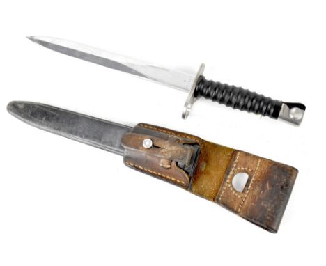 A Swiss M1957 S.I.G bayonet with 33.5cm double-edged blade, in black composite scabbard and leather frog. CONDITION REPORT Fr