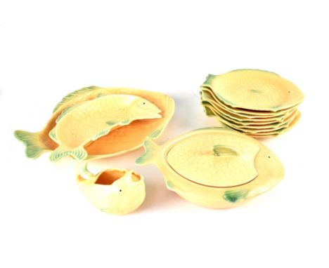A Shorter c1930s set of fish dishes to include a tureen, nine plates, an oval platter and a smaller example and a sauce boat,