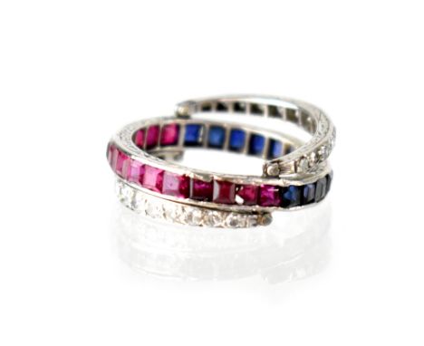 A platinum diamond, ruby and sapphire 'Day and Night' eternity ring, the platinum central band (stamped plat) set with square