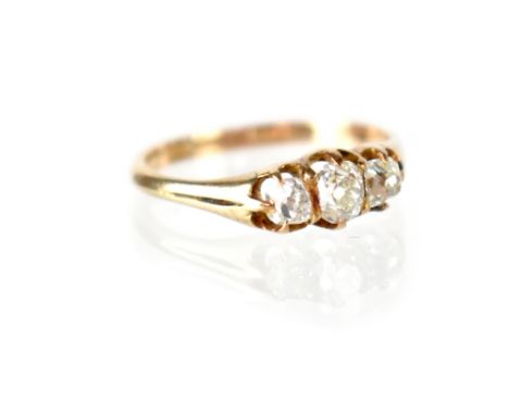 A 9ct gold ring set with three diamonds in claw scalloped setting, diamonds total 0.9ct, stamped 9CT, approx 2.5g. CONDITION 