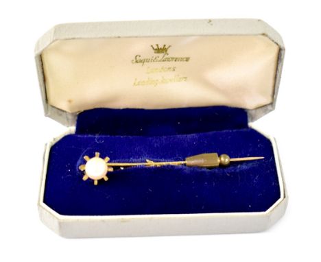 A 9ct yellow gold stick pin with single pearl in sunburst setting.