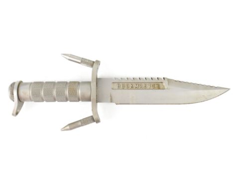 A Buckmaster model 184 US Navy Seal designed survival knife, lacking sheath. CONDITION REPORT From a shop display cabinet and