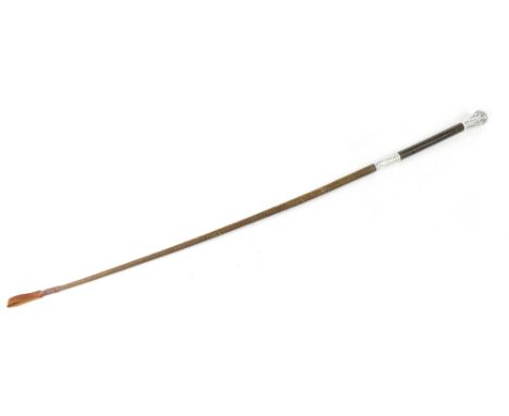 A late Victorian hallmarked silver and braided leather long riding crop, the handle ornately decorated with scrolls, flowers 