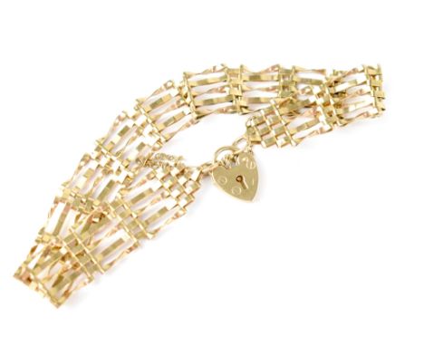 A 9ct gold five bar gate bracelet with heart shape padlock clasp, stamped 375, approx 6.6g.