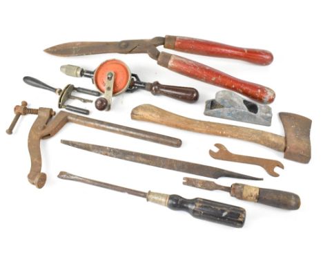 A collection of vintage garden tools to include scythe, gardening shears, various hammers, files, wooden plane, various other