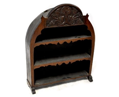 Antique oak shelves, the table top shelves with grape and flower carved dome top over three short shelves with shaped aprons 