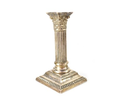 A Victorian hallmarked silver candlestick in the form of a Corinthian column on a square stepped base, maker's mark indistinc