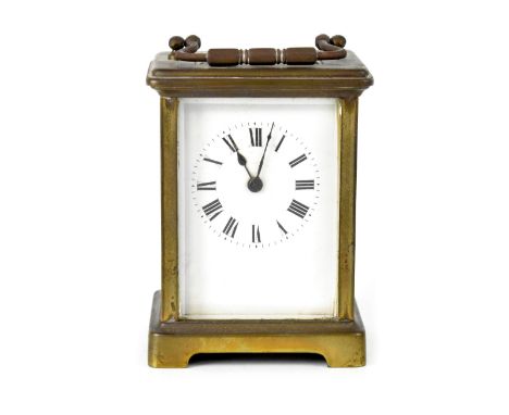 An SF brass carriage clock, the white enamelled dial set with Roman numerals, height 11cm. CONDITION REPORT There is a crack 