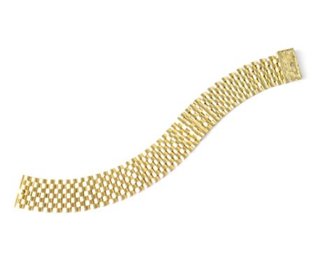 A vintage 9ct gold hallmarked seven bar flexi gate bracelet with textured pull lock clasp, length approx 19cm approx 28.3g.