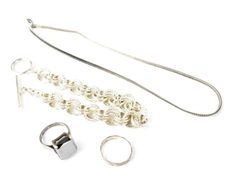 Four silver hallmarked items comprising a chin link bracelet with bar and ring clasp, a flat link necklace, a ring with geome