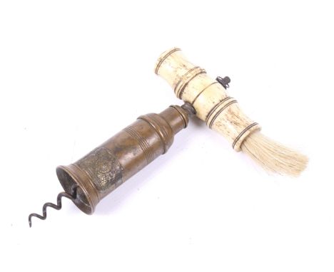 A early 19th century Thomason type patent corkscrew. The turned bone handle with a steel hanging loop and brush, brass and st