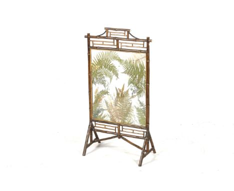 A 19th century bamboo framed fire screen. The glass panel displaying a naturalistic scene constructed of pressed foliage and 