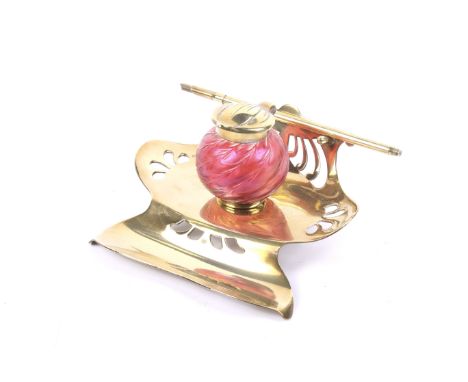 An Art Nouveau Loetz art glass inkwell. Austrian circa 1900, the iridescent red glass with a wavy design to the body and a br