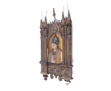 An antique plaster and wood religious wall plaque. The tabernacle frame of gothic design, the central panel featuring a resin
