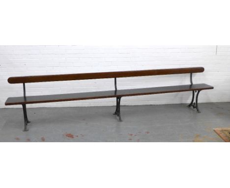 Early 20th century stained pine pew / bench with black iron supports, 330 x 73 x 28cm 